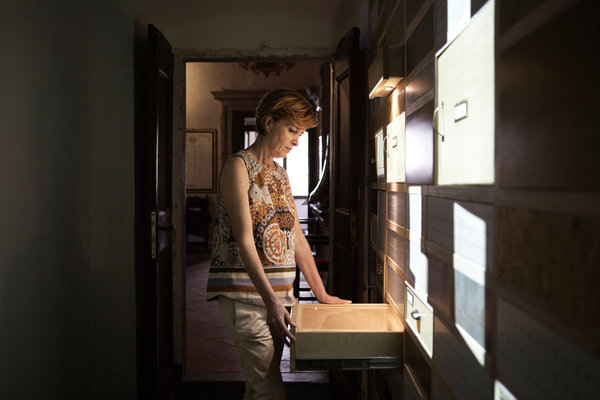 Natalia Cangi, the director of the National Diary Archive Foundation. More than 7,000 memoirs line the archive’s shelves. Credit Alessandro Penso for The New York Times.  From http://www.nytimes.com/2014/08/20/world/europe/a-trove-of-diaries-meant-to-be-read-by-others.html?_r=0